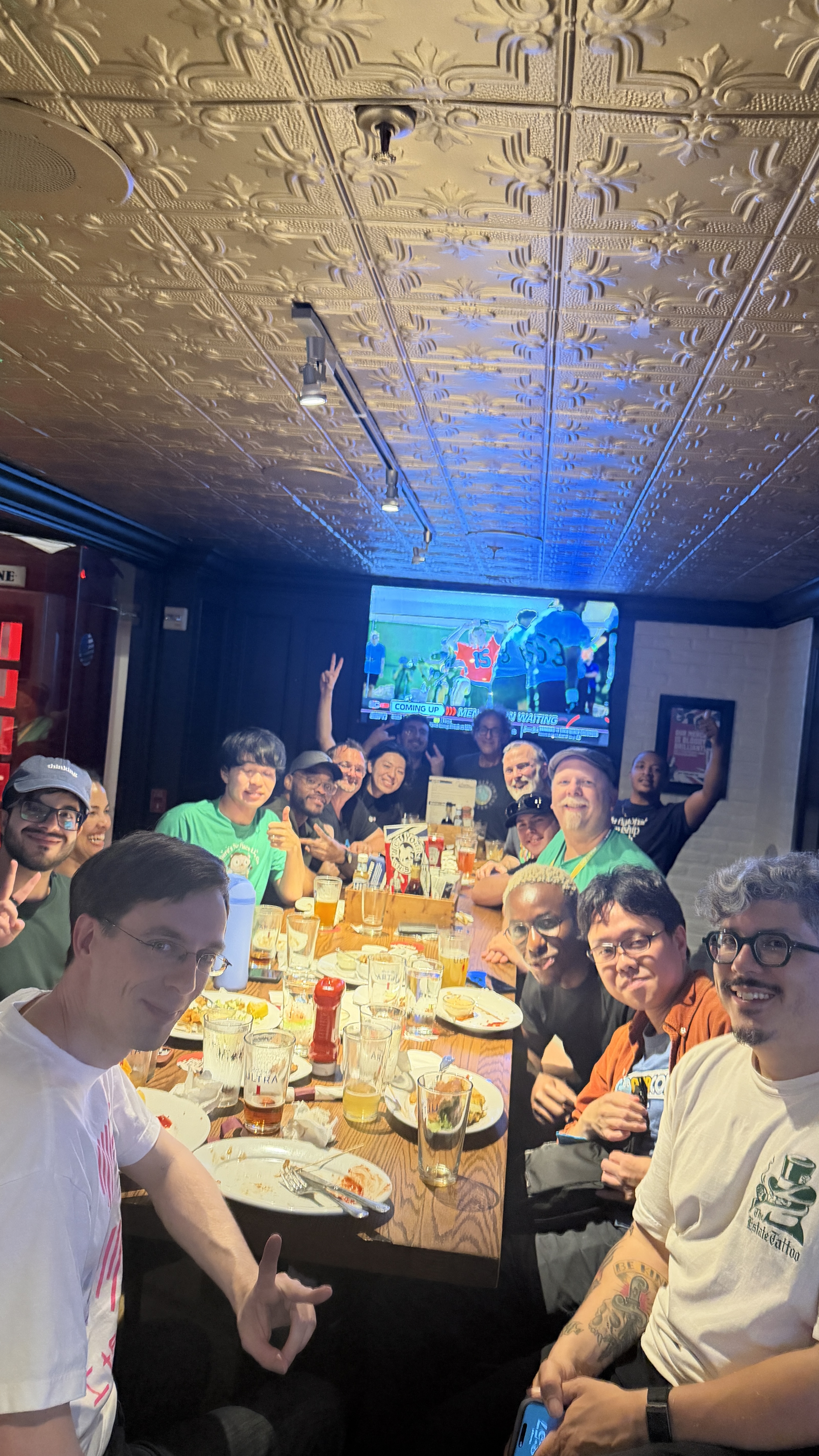 The group of Gophers I spent the conference with, packed around a long table of food and drinks at a bar afterward
